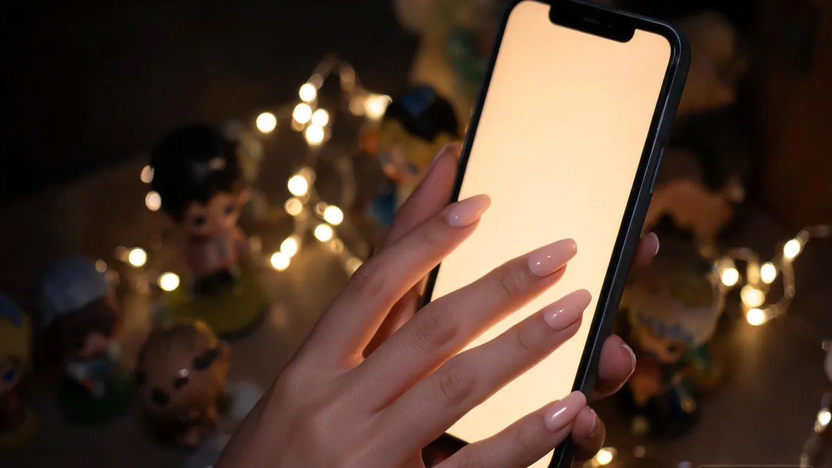 Harem-style AI girlfriend setup experienced through a phone, with multiple companion vibes a tap away in a warm, intimate atmosphere