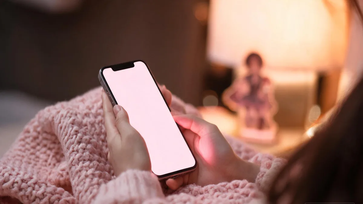 An AI girlfriend companion app glowing in the evening, the modern version of the husbando feeling, a fictional partner who answers back