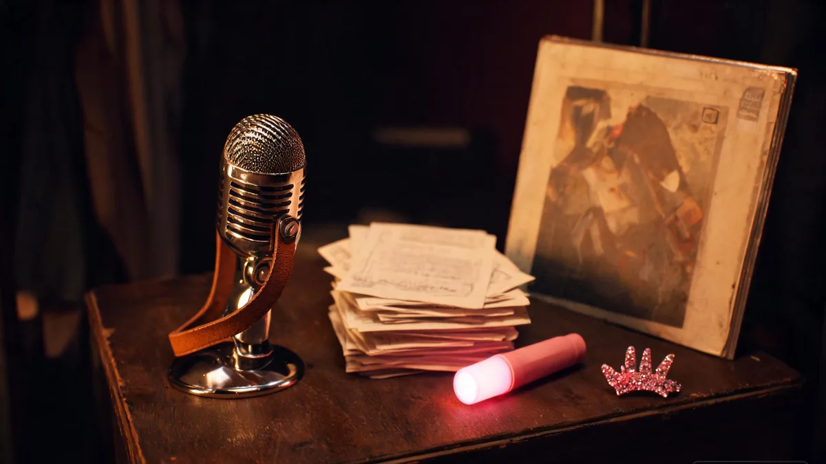 The origin of the Japanese idol industry, with concert memorabilia, glow-sticks, and CDs on a warm wooden desk that tell the story of how the idol scene grew through the 1970s and 1980s