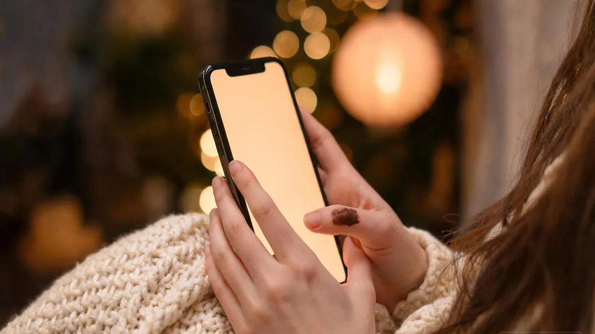 School festival AI girlfriend companion experienced through a chat app, with a festival mask and candy apple on a wooden table at golden hour