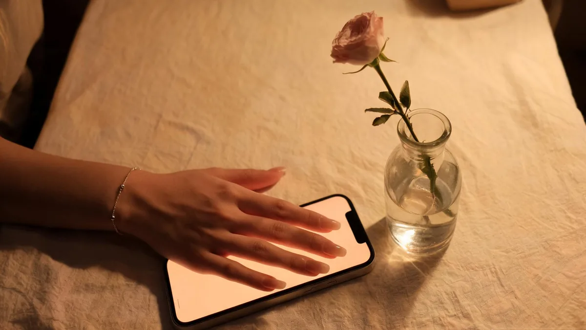 Submissive AI girlfriend companion experienced through a chat app, warm and attentive any time you open your phone